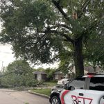 Betz Exterior Solutions parked in the street surrounded by storm damage