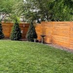 New wooden privacy fence in backyard